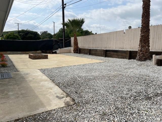 1197 Colony Dr, Pomona, CA 91766 - view of yard featuring a patio area, fence private yard, and an outdoor fire pit