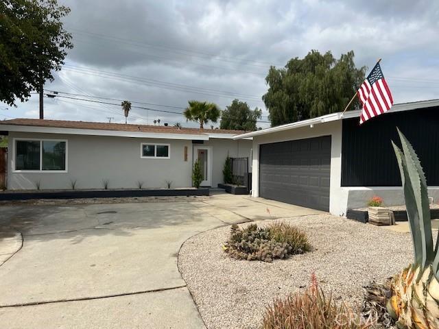 1197 Colony Dr, Pomona, CA 91766 - ranch-style home featuring concrete driveway and stucco siding