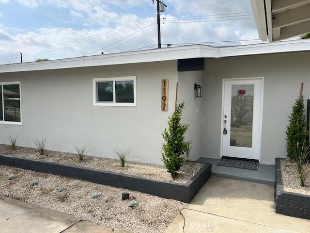 1197 Colony Dr, Pomona, CA 91766 - entrance to property with stucco siding
