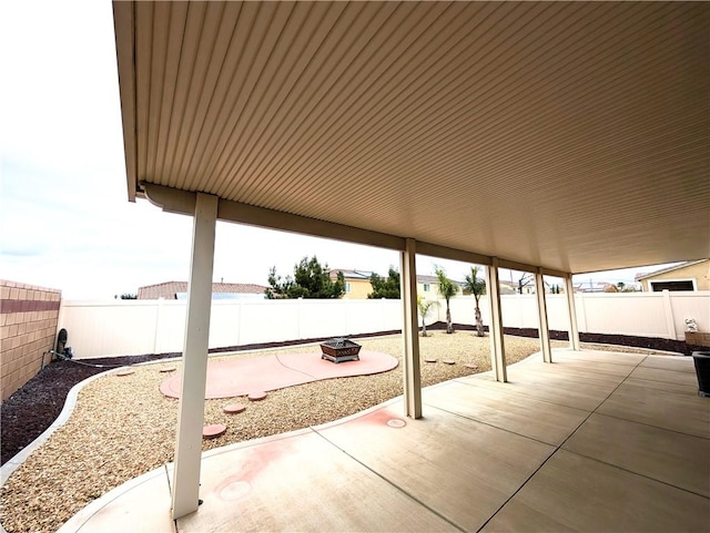 view of patio / terrace with a fire pit and a fenced backyard
