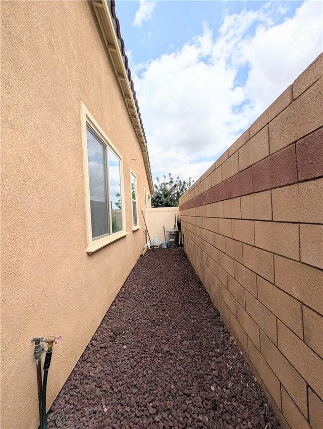 1617 Sinton Ct, Beaumont, CA 92223 - view of home's exterior featuring stucco siding and fence