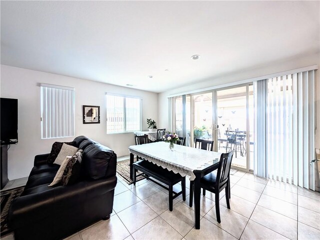 dining space featuring light tile patterned floors