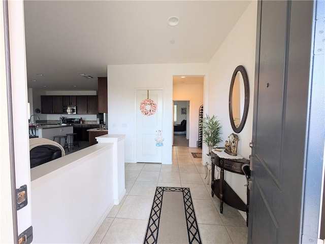 foyer featuring light tile patterned floors