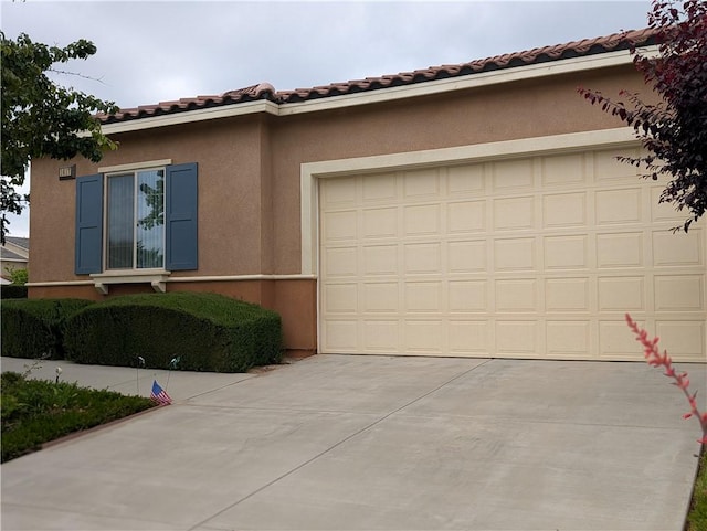1617 Sinton Ct, Beaumont, CA 92223 - view of property exterior with concrete driveway, stucco siding, a garage, and a tiled roof
