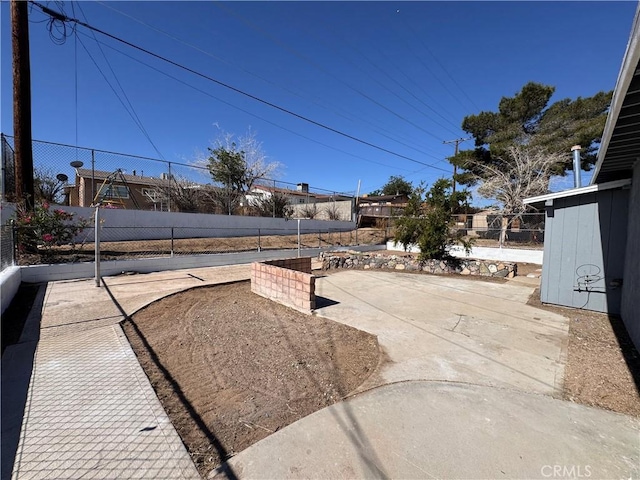 1716 Paloma St, Barstow, CA 92311 - view of yard featuring a patio area and fence