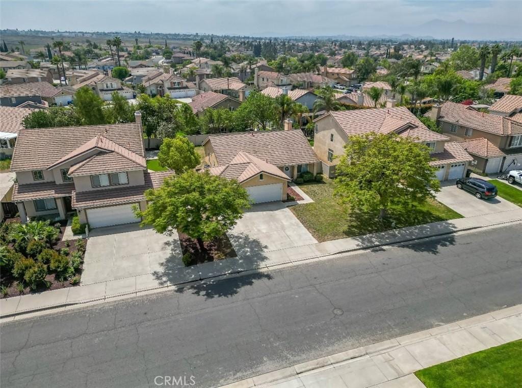 birds eye view of property with a residential view