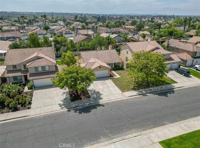 birds eye view of property with a residential view