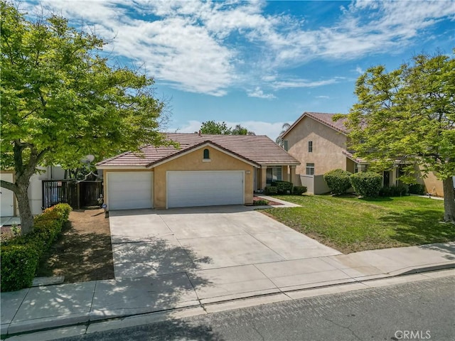 831 Kilmarnock Way, Riverside, CA 92508 - view of front facade featuring driveway, a tiled roof, a garage, stucco siding, and a front lawn