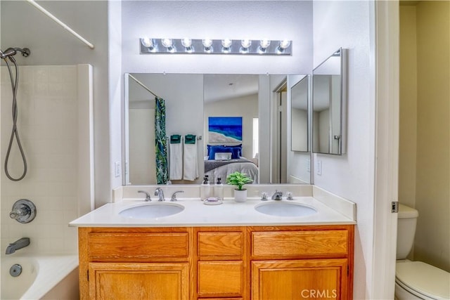831 Kilmarnock Way, Riverside, CA 92508 - bathroom featuring double vanity, toilet, shower / bathing tub combination, and a sink