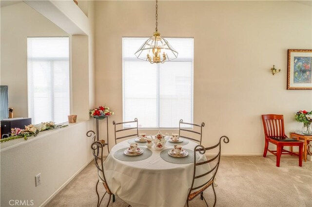 831 Kilmarnock Way, Riverside, CA 92508 - dining room with light colored carpet, plenty of natural light, baseboards, and a chandelier