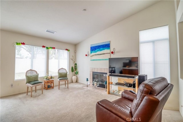 831 Kilmarnock Way, Riverside, CA 92508 - living room with a fireplace, vaulted ceiling, carpet flooring, and visible vents