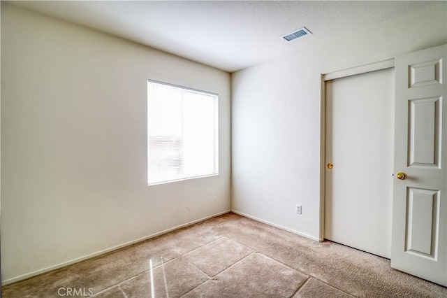 831 Kilmarnock Way, Riverside, CA 92508 - unfurnished bedroom featuring carpet flooring, baseboards, and visible vents
