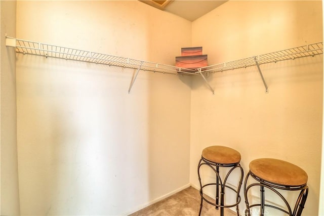 831 Kilmarnock Way, Riverside, CA 92508 - walk in closet featuring light colored carpet
