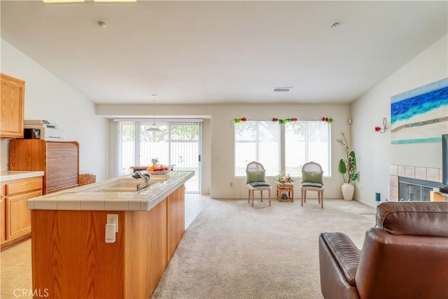 831 Kilmarnock Way, Riverside, CA 92508 - interior space featuring light carpet, a fireplace, and visible vents