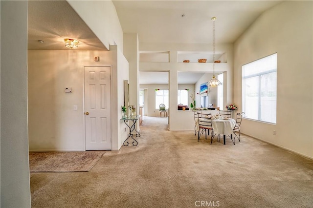 831 Kilmarnock Way, Riverside, CA 92508 - dining space with baseboards, light carpet, and a chandelier