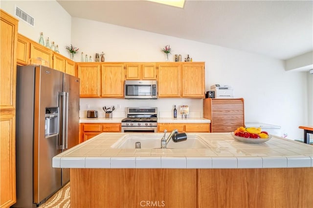 831 Kilmarnock Way, Riverside, CA 92508 - kitchen with a sink, lofted ceiling, stainless steel appliances, visible vents, and light countertops