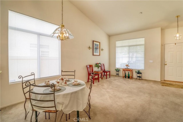 831 Kilmarnock Way, Riverside, CA 92508 - dining space with carpet flooring, plenty of natural light, high vaulted ceiling, and a notable chandelier