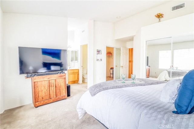 831 Kilmarnock Way, Riverside, CA 92508 - bedroom featuring light colored carpet, ensuite bathroom, visible vents, and a high ceiling