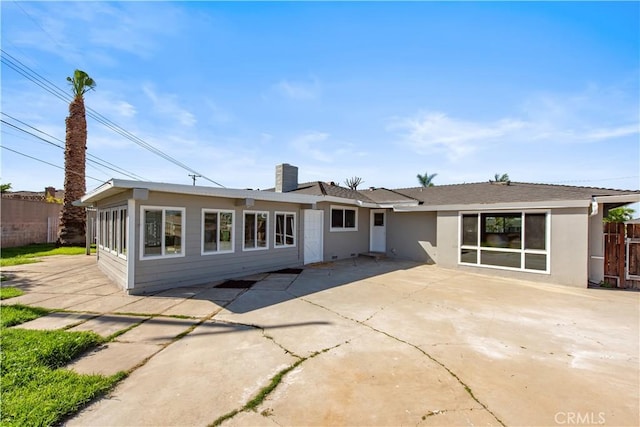 781 E Navilla Pl, Covina, CA 91723 - back of property featuring a patio, a chimney, stucco siding, and fence