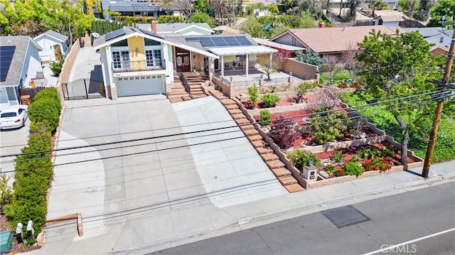 17841 Buena Vista Ave, Yorba Linda, CA 92886 - view of front of house with roof mounted solar panels, driveway, a garden, a gate, and a garage