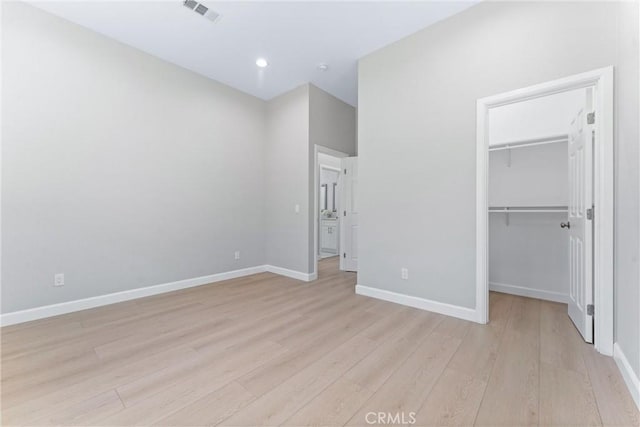 17841 Buena Vista Ave, Yorba Linda, CA 92886 - unfurnished bedroom with light wood-style flooring, a walk in closet, a closet, and recessed lighting