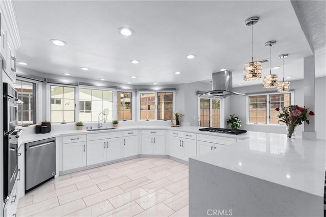 17841 Buena Vista Ave, Yorba Linda, CA 92886 - kitchen with stainless steel appliances, island exhaust hood, recessed lighting, white cabinetry, and decorative light fixtures