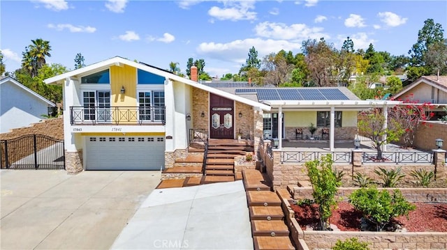 17841 Buena Vista Ave, Yorba Linda, CA 92886 - view of front of house featuring solar panels, an attached garage, stucco siding, concrete driveway, and stone siding