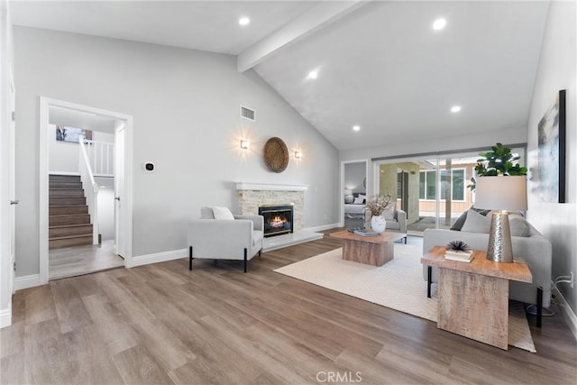 17841 Buena Vista Ave, Yorba Linda, CA 92886 - living room with beam ceiling, stairway, a fireplace, wood finished floors, and high vaulted ceiling