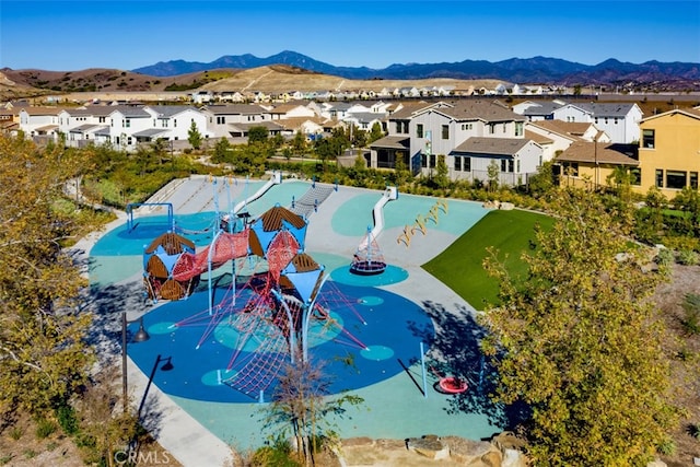 birds eye view of property featuring a mountain view and a residential view