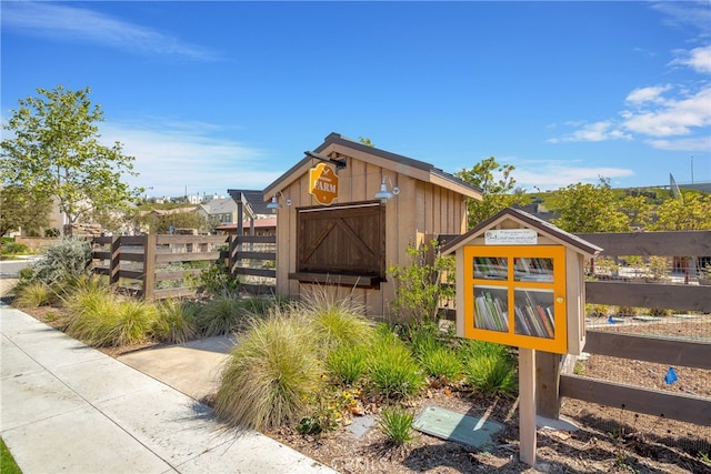 view of shed with fence