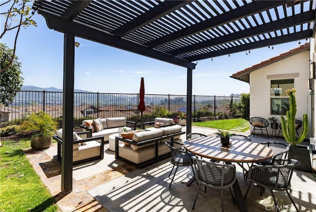 view of patio featuring a fenced backyard, a mountain view, a pergola, outdoor lounge area, and outdoor dining space