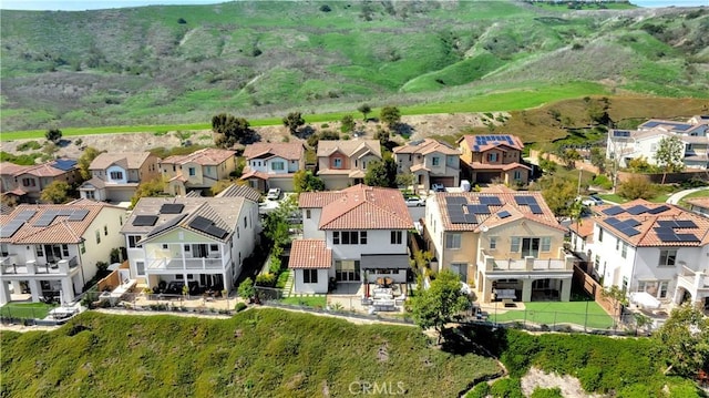 birds eye view of property with a residential view and a mountain view