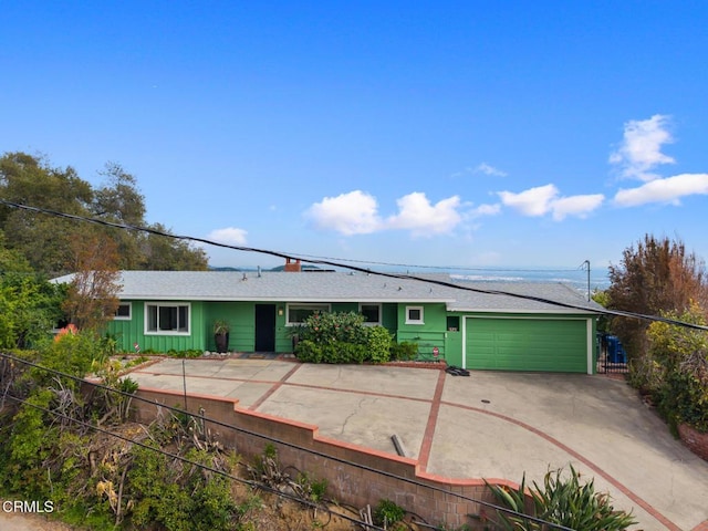 675 Mount Wilson Trl, Sierra Madre, CA 91024 - ranch-style home featuring concrete driveway, an attached garage, and roof with shingles