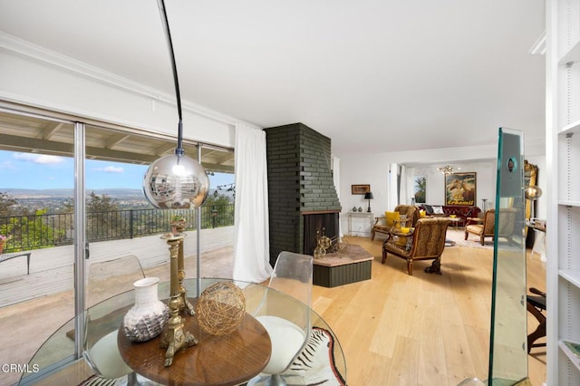 675 Mount Wilson Trl, Sierra Madre, CA 91024 - dining space with a fireplace and wood finished floors