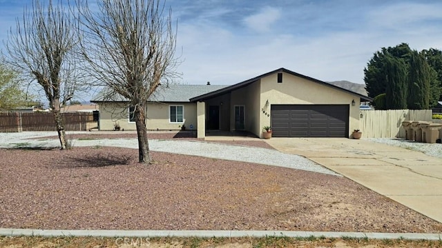 7469 Madera Ave, Hesperia, CA 92345 - single story home featuring an attached garage, driveway, fence, and stucco siding