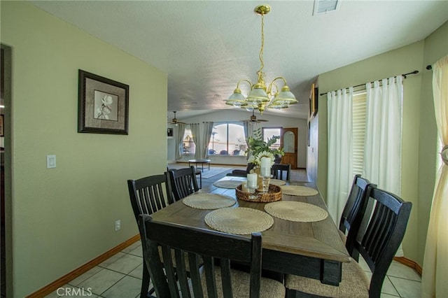 7469 Madera Ave, Hesperia, CA 92345 - dining space with light tile patterned flooring, vaulted ceiling, baseboards, visible vents, and ceiling fan with notable chandelier