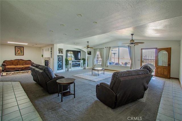7469 Madera Ave, Hesperia, CA 92345 - tiled living area with lofted ceiling, baseboards, a textured ceiling, and ceiling fan