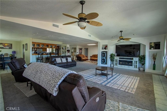 7469 Madera Ave, Hesperia, CA 92345 - living room with ceiling fan, lofted ceiling, a textured ceiling, and visible vents