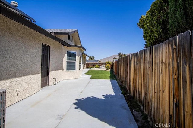 7469 Madera Ave, Hesperia, CA 92345 - exterior space with a patio area, a fenced backyard, and stucco siding