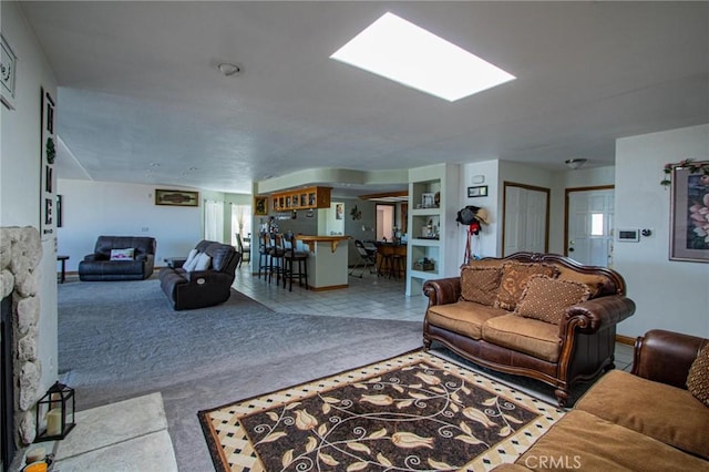 7469 Madera Ave, Hesperia, CA 92345 - carpeted living room with tile patterned floors