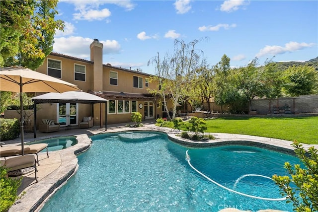view of pool with a gazebo, french doors, an outdoor hangout area, a patio area, and a pool with connected hot tub