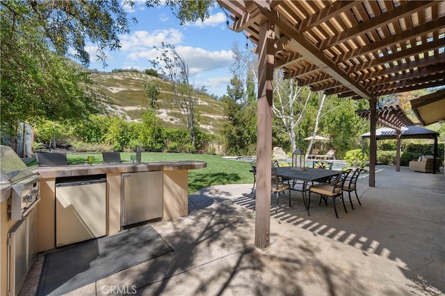 view of patio with a pergola and outdoor dining area