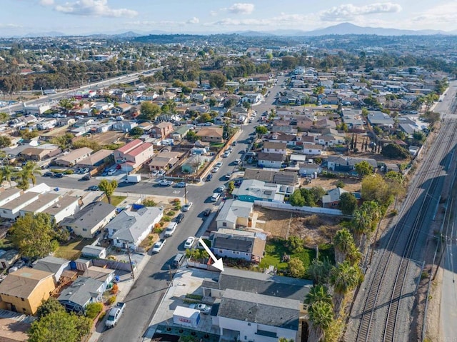 drone / aerial view featuring a mountain view and a residential view