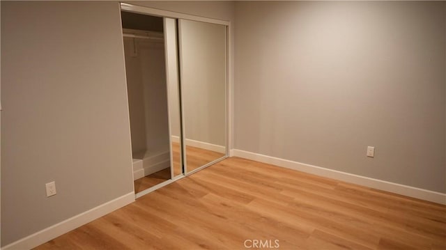 14610 Appleton St, Hesperia, CA 92345 - unfurnished bedroom with light wood-type flooring, baseboards, and a closet