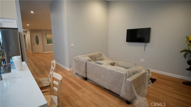 14610 Appleton St, Hesperia, CA 92345 - living area featuring light wood finished floors, recessed lighting, and baseboards