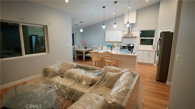 14610 Appleton St, Hesperia, CA 92345 - living area with light wood-type flooring, lofted ceiling, recessed lighting, and baseboards