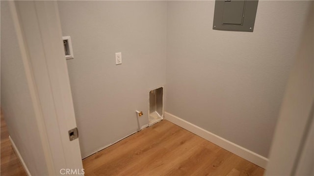 14610 Appleton St, Hesperia, CA 92345 - clothes washing area with electric panel, light wood-style flooring, and baseboards