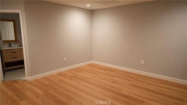 14610 Appleton St, Hesperia, CA 92345 - spare room featuring recessed lighting, baseboards, and light wood-style flooring