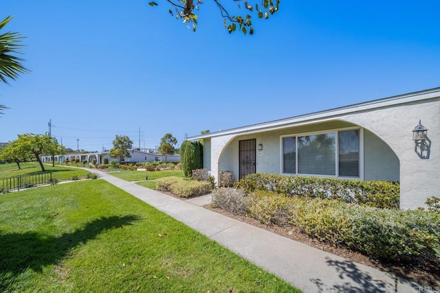 3567 Boussock Ln, Oceanside, CA 92057 - view of side of home featuring a lawn and stucco siding