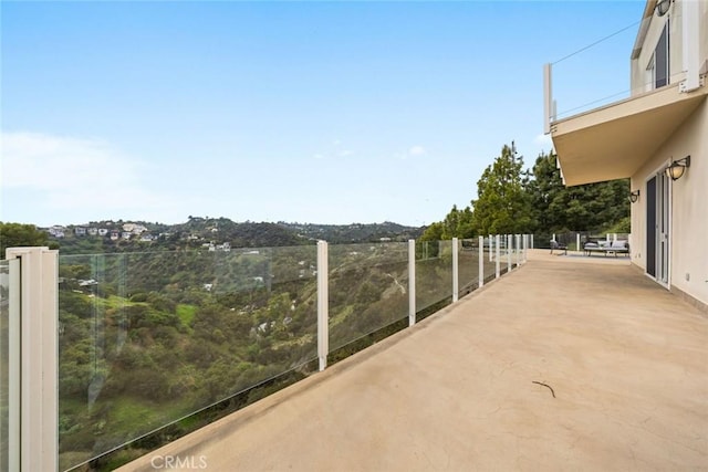 view of patio featuring a balcony